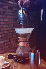 Image showing Barista brewing coffee