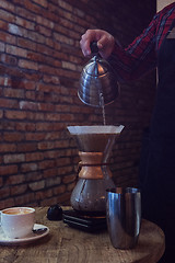 Image showing Barista brewing coffee