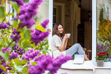 Image showing beautiful woman with a cup of hot drink