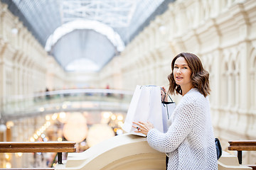 Image showing woman with packages in a shopping center