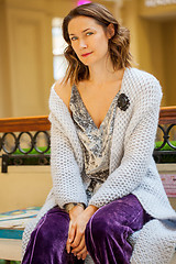 Image showing woman in gray knitted coat with black brooch