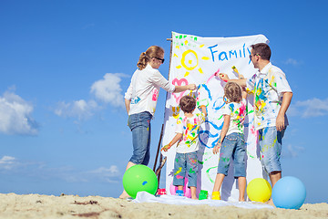 Image showing Happy family playing on the beach at the day time.