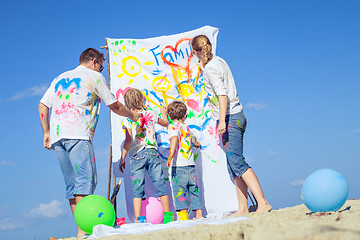 Image showing Happy family playing on the beach at the day time.