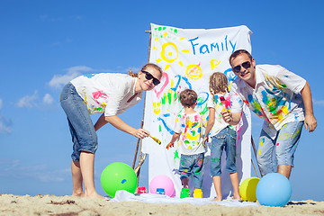 Image showing Happy family playing on the beach at the day time.