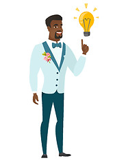 Image showing Groom pointing at business idea light bulb.