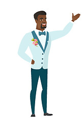 Image showing African-american groom showing a direction.