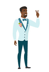 Image showing African groom showing the victory gesture.