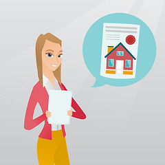 Image showing Woman reading real estate advertisement.