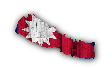 Image showing Map and flag of Nepal on weathered wood