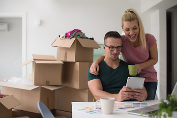 Image showing Young couple moving in a new home