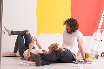 Image showing Happy young couple relaxing after painting