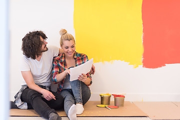 Image showing Happy young couple relaxing after painting