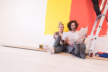 Image showing Happy young couple relaxing after painting