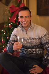 Image showing Happy young man with a glass of champagne