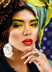 Image showing beauty bright woman with creative make up, many shawls on head l