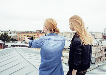 Image showing two cool blond real girls friends making selfie on roof top, lifestyle people concept, modern teens