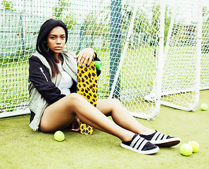 Image showing cool pretty smiling afro-american happy young woman with skate b