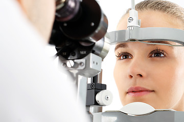 Image showing Computer aided visual acuity. The patient during an eye examination at the eye clinic 