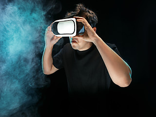 Image showing The man with glasses of virtual reality. Future technology concept.