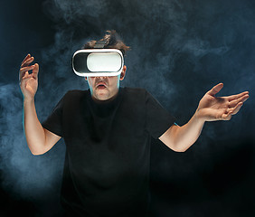 Image showing The man with glasses of virtual reality. Future technology concept.