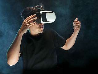 Image showing The man with glasses of virtual reality. Future technology concept.