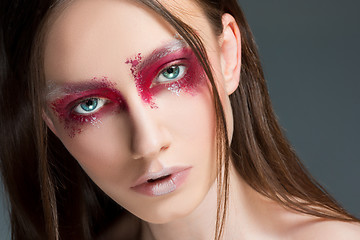 Image showing Beautiful woman face portrait close up with red make up