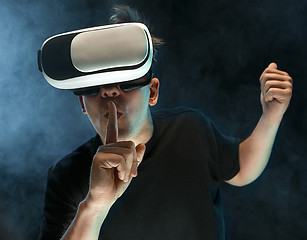 Image showing The man with glasses of virtual reality. Future technology concept.