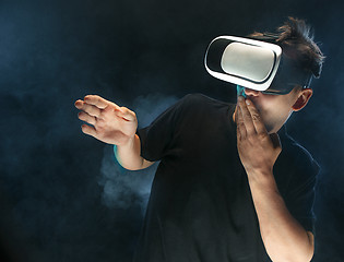 Image showing The man with glasses of virtual reality. Future technology concept.