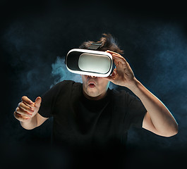 Image showing The man with glasses of virtual reality. Future technology concept.