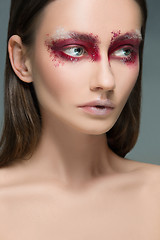 Image showing Beautiful woman face portrait close up with red make up