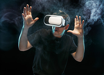 Image showing The man with glasses of virtual reality. Future technology concept.