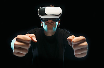 Image showing The man with glasses of virtual reality. Future technology concept.