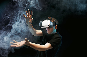 Image showing The man with glasses of virtual reality. Future technology concept.