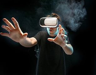 Image showing The man with glasses of virtual reality. Future technology concept.