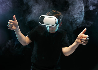 Image showing The man with glasses of virtual reality. Future technology concept.