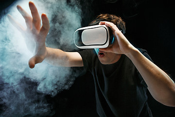 Image showing The man with glasses of virtual reality. Future technology concept.