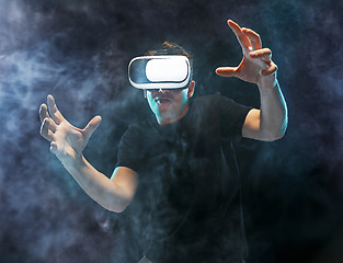 Image showing The man with glasses of virtual reality. Future technology concept.