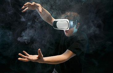 Image showing The man with glasses of virtual reality. Future technology concept.