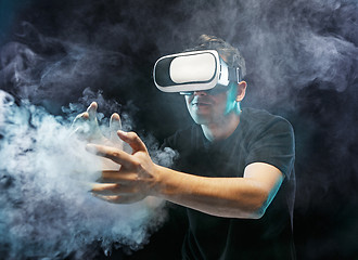 Image showing The man with glasses of virtual reality. Future technology concept.