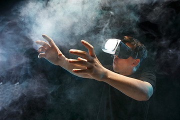 Image showing The man with glasses of virtual reality. Future technology concept.