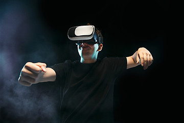 Image showing The man with glasses of virtual reality. Future technology concept.