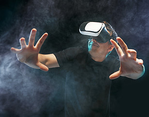 Image showing The man with glasses of virtual reality. Future technology concept.