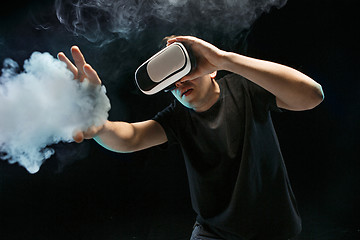 Image showing The man with glasses of virtual reality. Future technology concept.