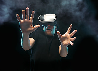 Image showing The man with glasses of virtual reality. Future technology concept.