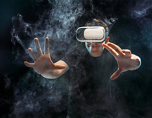 Image showing The man with glasses of virtual reality. Future technology concept.
