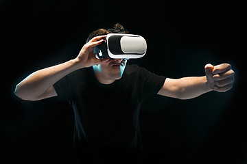 Image showing The man with glasses of virtual reality. Future technology concept.