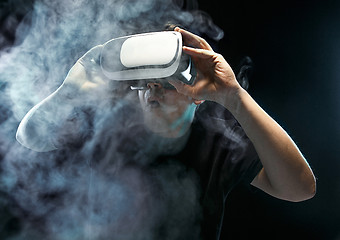 Image showing The man with glasses of virtual reality. Future technology concept.