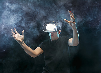 Image showing The man with glasses of virtual reality. Future technology concept.