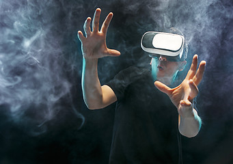 Image showing The man with glasses of virtual reality. Future technology concept.