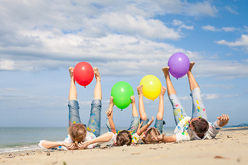 Image showing Happy family playing on the beach at the day time.